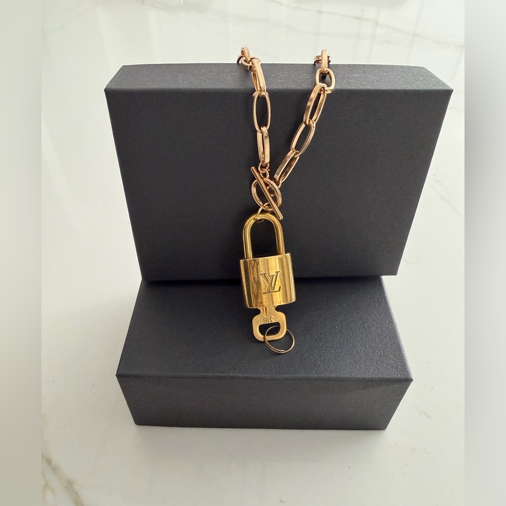 Louis Vuitton Gold Padlock # 316